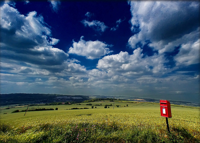 Lone postbox in a countryside landscape
